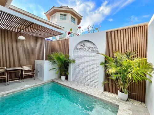 a swimming pool in the backyard of a house at Bangsaen Cabana บางแสน คาบาน่า in Ban Thai Don (1)