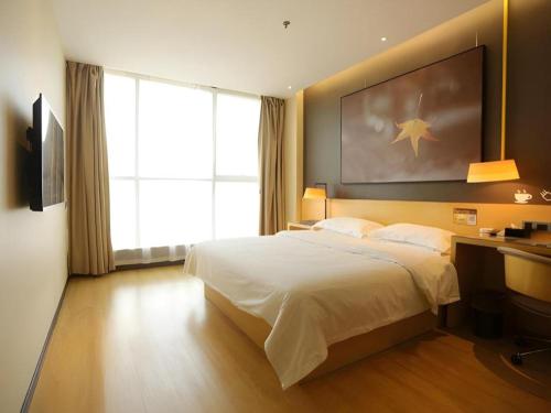 Postel nebo postele na pokoji v ubytování IU Hotels·Tongling Beidouxingcheng