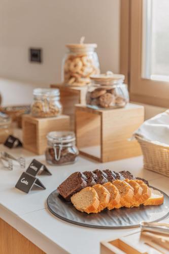 a plate with a loaf of bread on a counter at Aelo Mykonos Hotel in Paradise Beach