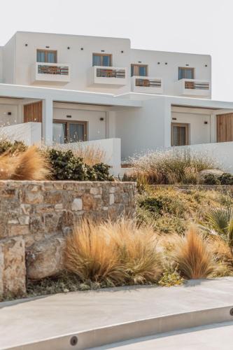 a white building with balconies on the side of it at Aelo Mykonos Hotel in Paradise Beach