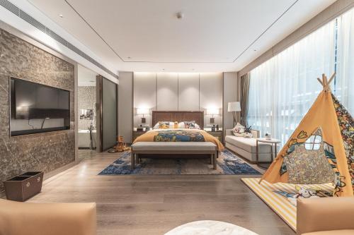 a bedroom with a bed and a christmas tree at Changzhou Wenpu Hotel Changzhou Culture Square Branch in Changzhou