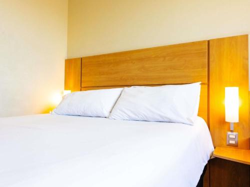 Postel nebo postele na pokoji v ubytování ibis Valparaiso