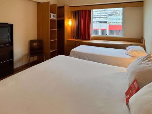Postel nebo postele na pokoji v ubytování ibis Valparaiso