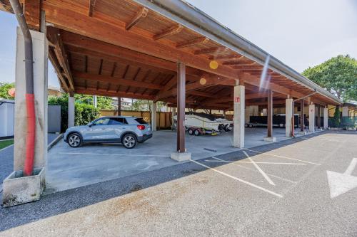 a parking lot with a car parked in it at Hotel Ristorante Al Fiore in Peschiera del Garda