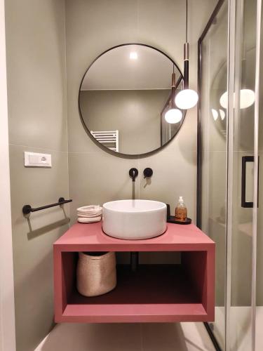 a bathroom with a sink and a mirror at FORTUNA Suite & Terrace in Salerno