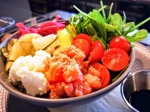 a bowl of food with vegetables on a table at Mercure Milano Agrate Brianza in Agrate Brianza