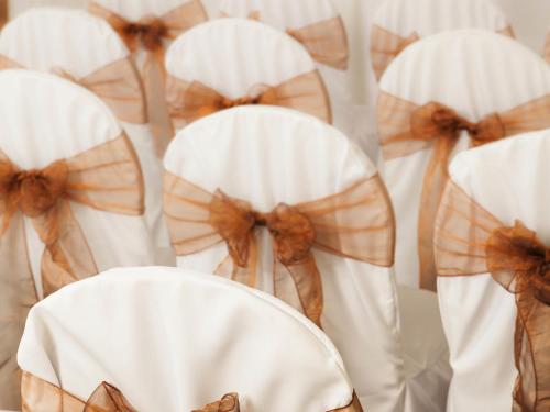 a group of white chairs with bows on them at Mercure Tunbridge Wells Hotel in Royal Tunbridge Wells
