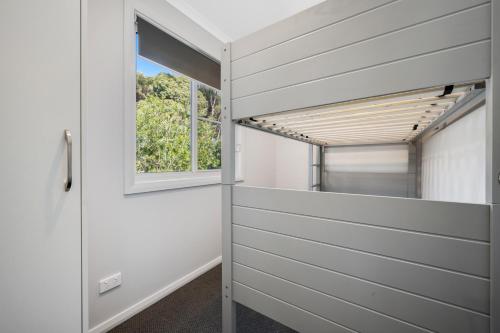 a room with white walls and a window at Thunderbird Motel Yass in Yass