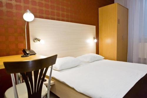 Letto o letti in una camera di Hotel Olsi
