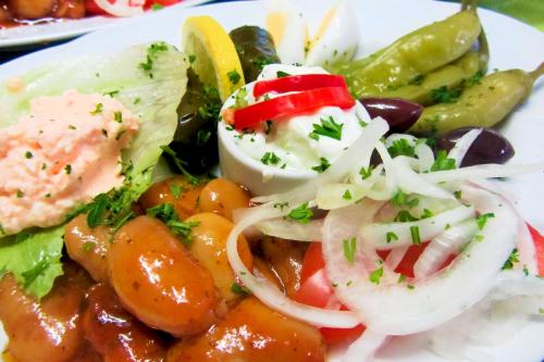 a white plate of food with vegetables on it at Grüner Baum in Neckargerach