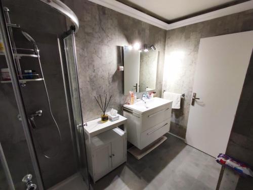 a bathroom with a sink and a shower at Mas de Tanit Appartement & Vacance deLuxe in Antibes