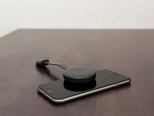a cell phone with a charger on a table at Aparthotel Adagio Access Paris Porte De Charenton in Charenton-le-Pont