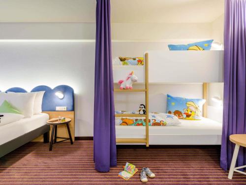 Кровать или кровати в номере ibis Styles Leipzig