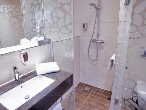 Ванная комната в ibis Styles Leipzig