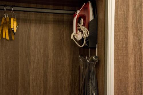 a pair of scissors are hanging in a closet at فندق اعلي الثناء - Max Praise Hotel in Yanbu