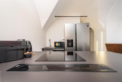 Η κουζίνα ή μικρή κουζίνα στο Aosta Centro Storico - Yayoi Apartment Netflix & Relax