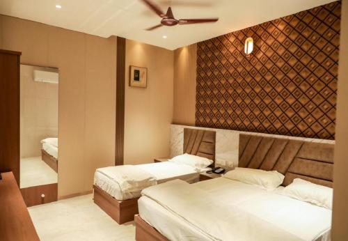 Katil atau katil-katil dalam bilik di Giri Comfort