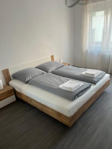 a bedroom with a large bed with a wooden frame at Apartman Riegrova 41 in Děčín