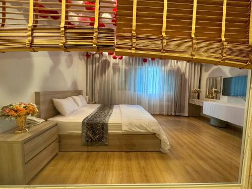 Postel nebo postele na pokoji v ubytování Sunna Hotel