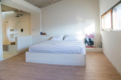 Una cama o camas en una habitación de Seafront House in Vathi, Methana