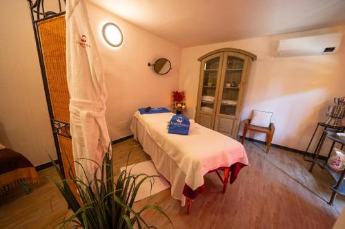 a bedroom with a bed and a table in it at Angiolina's Farm in Levanto