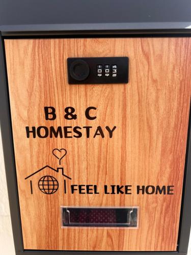 a wooden box with a sign that reads be homeaway i feel like home at B&C Homestay in Miri