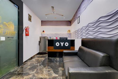 a waiting room with a couch and a table at Hotel O The Superior in Bhatha
