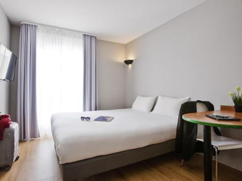 Katil atau katil-katil dalam bilik di Aparthotel Adagio Access Paris Maisons-Alfort