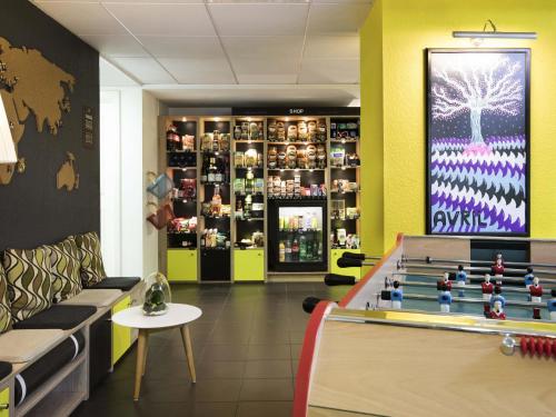 a store with a pool table in the middle of a room at Aparthotel Adagio Access Strasbourg Petite France in Strasbourg