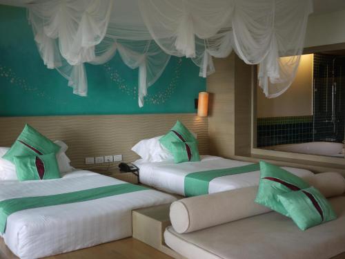 Ένα ή περισσότερα κρεβάτια σε δωμάτιο στο Mercure Koh Chang Hideaway