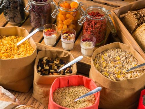 a table topped with containers of different types of food at ibis Edinburgh Centre South Bridge – Royal Mile in Edinburgh