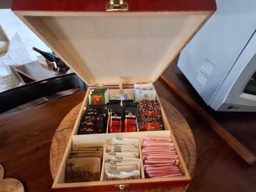a wooden box filled with different items on a table at דובדבן בגולן in Had Nes