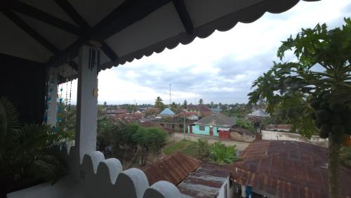 a view of a city from a balcony at Dhow House in Bagamoyo