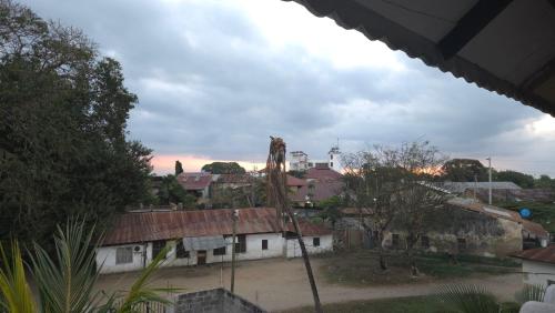 a view of a city with buildings and trees at Dhow House in Bagamoyo