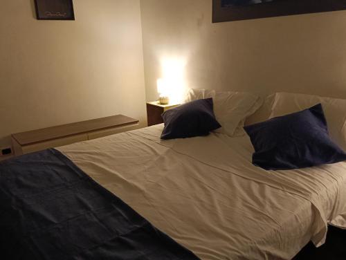 a bed with two pillows on it in a room at Diamond House in Gallipoli