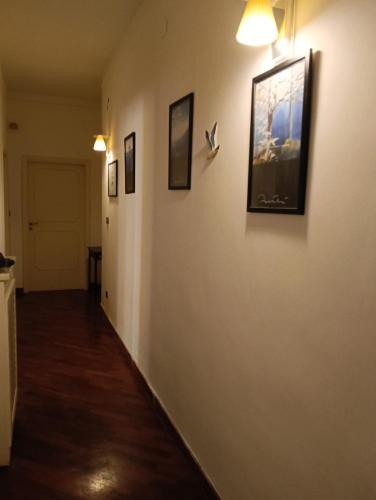a hallway with paintings on the walls of a room at Diamond House in Gallipoli
