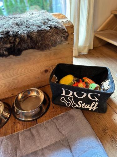 a box of toys and a bowl of food on a table at Romantikhütte in Flattach