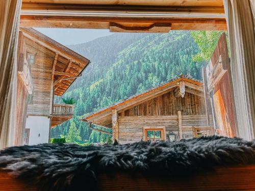 a view from a window of a log cabin at Romantikhütte in Flattach