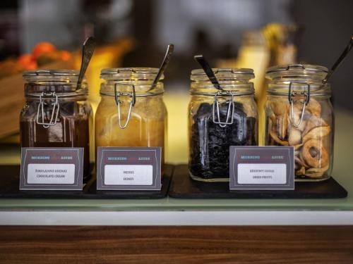 a display of jars of food on a shelf at Ibis Kaunas Centre in Kaunas