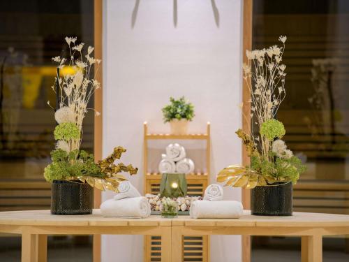 a altar with flowers and candles on a table at Pullman Munich in Munich