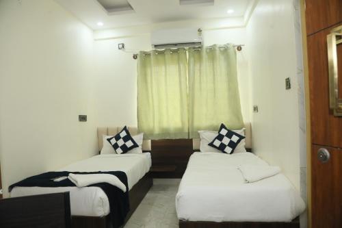 Postel nebo postele na pokoji v ubytování Hotel Rest O ITPL