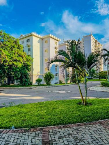 a palm tree in front of a building at Remarkable 5-Bed Apartment in Kilamba - Luanda in Luanda