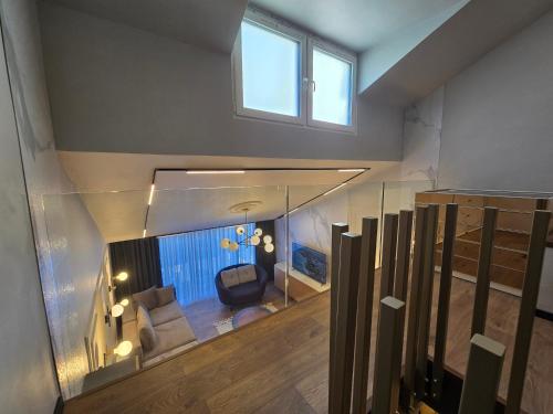 a room with a fish tank in the middle of a house at Apartments Lura in Peje