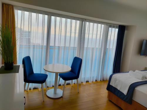 Кровать или кровати в номере Orbi city luxury Towers