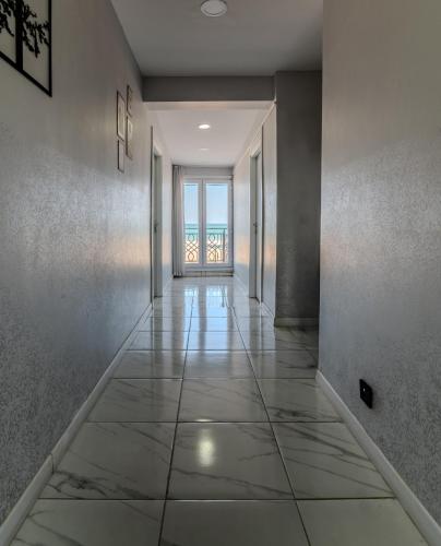 an empty hallway with a view of the ocean at Airport Black Sea Hotel & Restaurant in Arnavutköy
