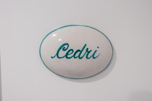 a white button with the word reddit written on it at Torre Paradiso in Minori