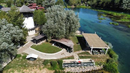 an aerial view of a house next to a river at Turističko naselje Natura Art-Hotel Opal Art in Lohovo