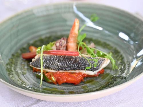 a plate of food with carrots and other vegetables at Mercure Brignoles Golf de Barbaroux & Spa in Brignoles