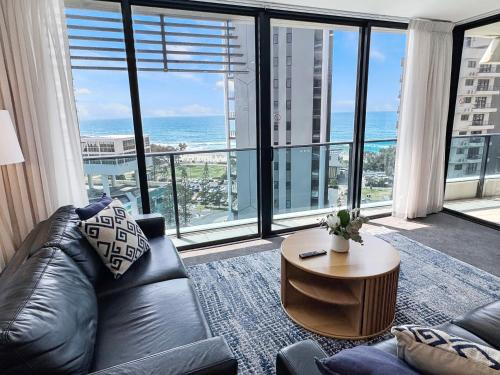 a living room with a couch and a table at Oracle 11th floor Tower 1 - GC Getaways in Gold Coast