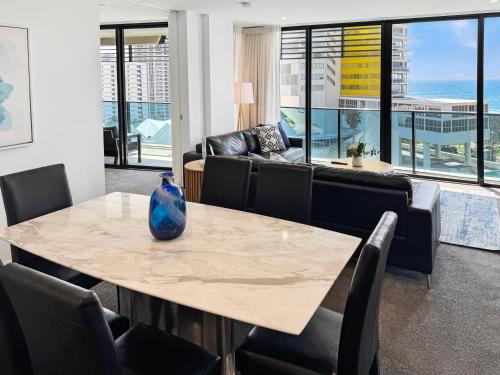 a room with a table with a vase on it at Oracle 11th floor Tower 1 - GC Getaways in Gold Coast